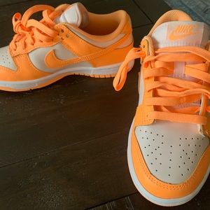 New. Never worn. women’s dunk, low “peach cream” size us5